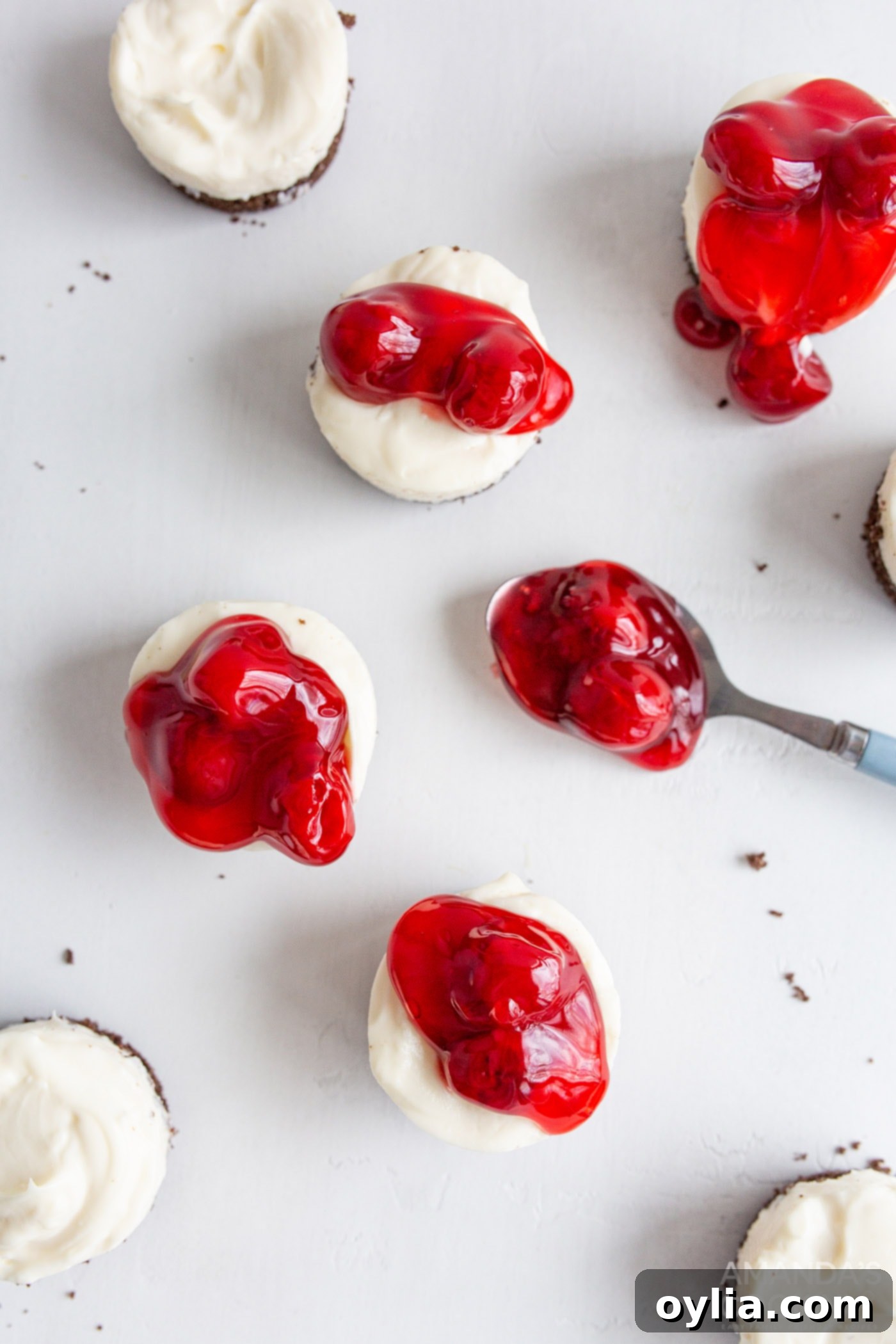 topping mini cheesecakes with cherry pie filling