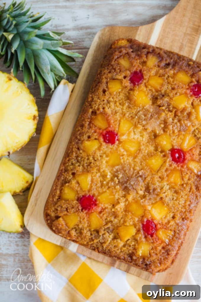 Delicious Pineapple Upside Down Cake with sliced pineapple and cherries