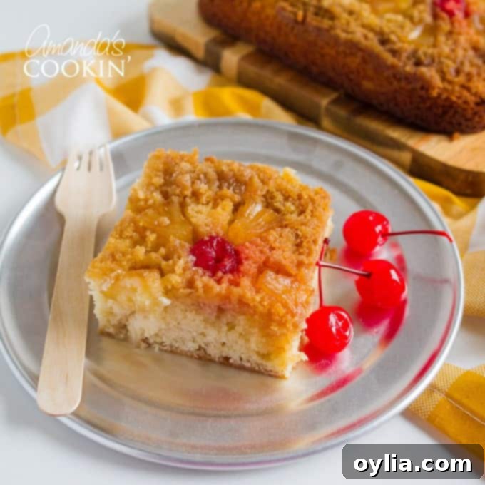 A delectable slice of homemade pineapple upside down cake on a white plate