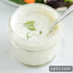 Velvety Dill Dressing 3 jelly jar of dill dressing with a spoon
