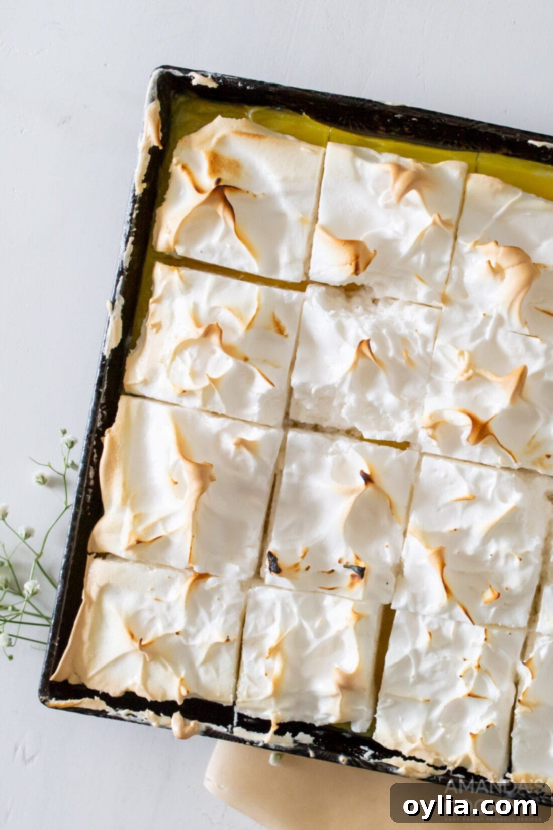 pan of Lemon Meringue Pie Bars cut into squares
