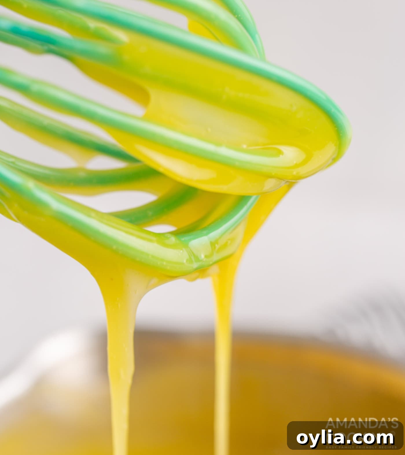 egg mixture drizzle on whisk