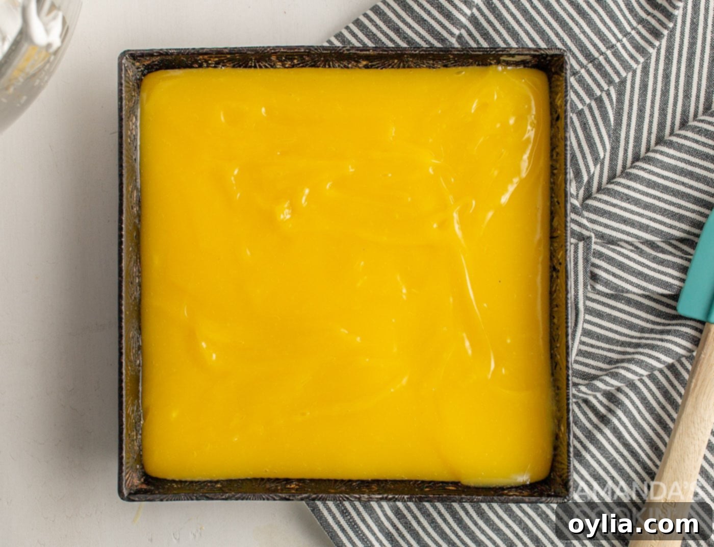 lemon mixture on top of crust in a baking pan