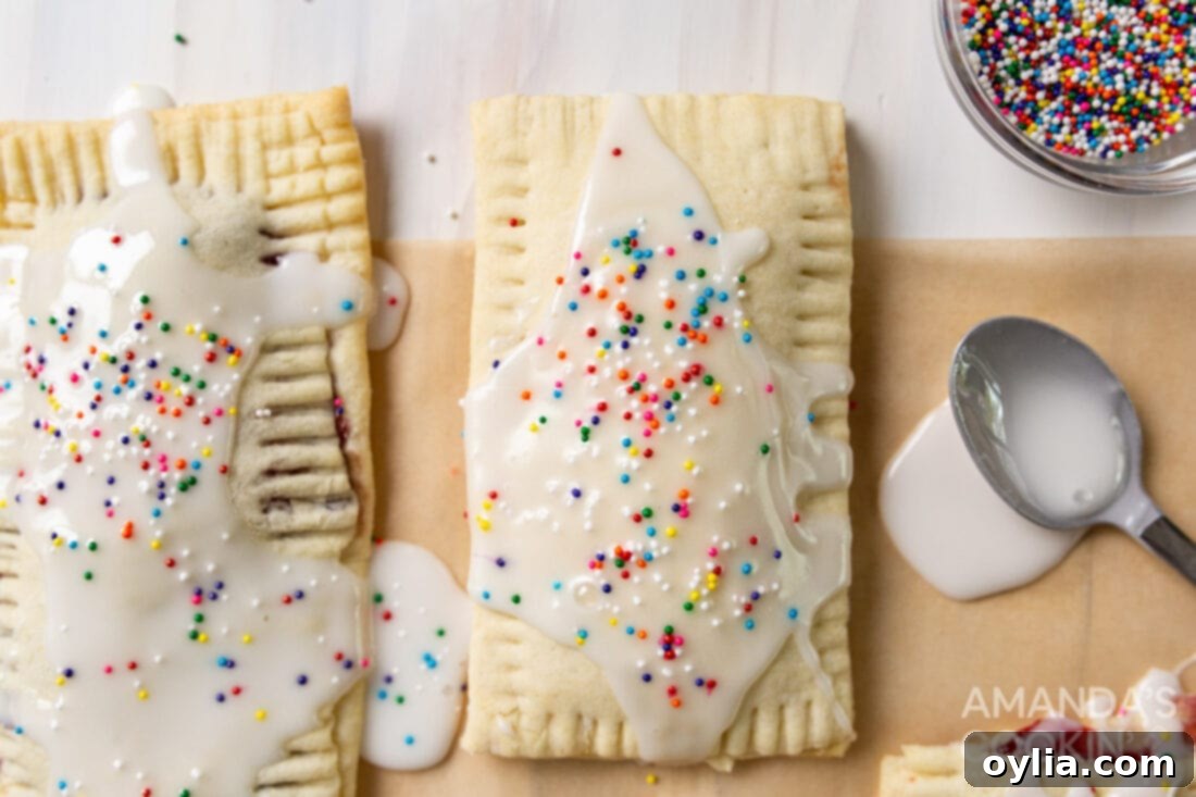 An assortment of delicious homemade pop tarts displayed on a rustic wooden board