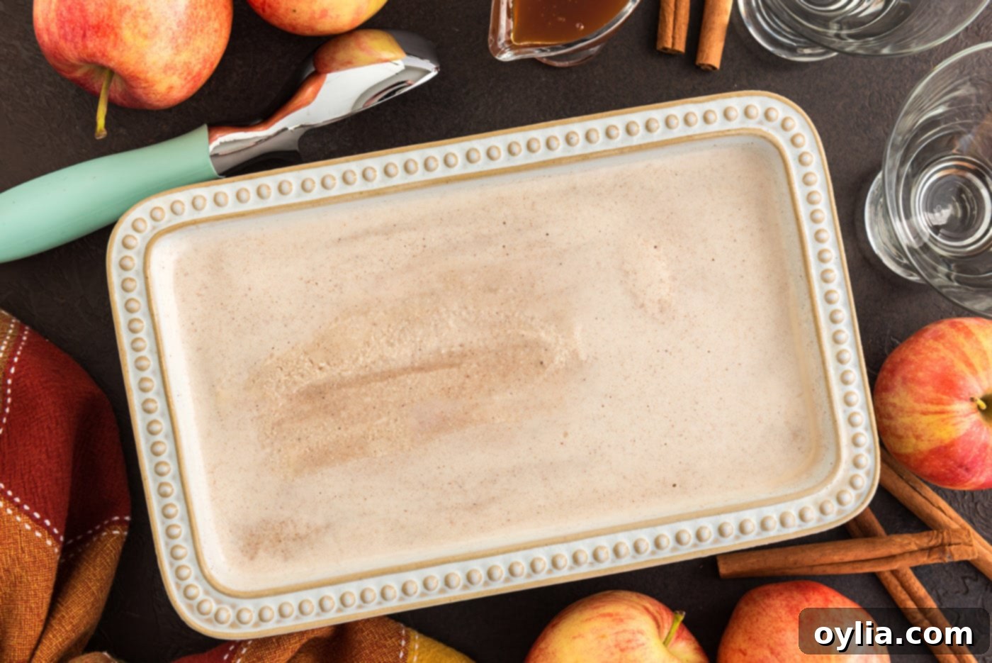 Freshly churned apple cider ice cream transferred into a loaf pan, ready for final freezing.
