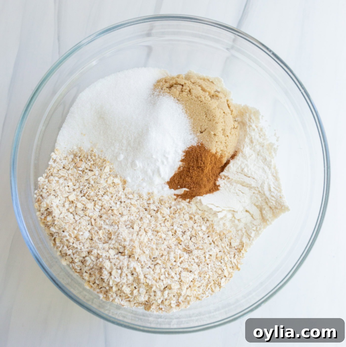 Crumble topping ingredients in a bowl, showing the texture after butter is incorporated.