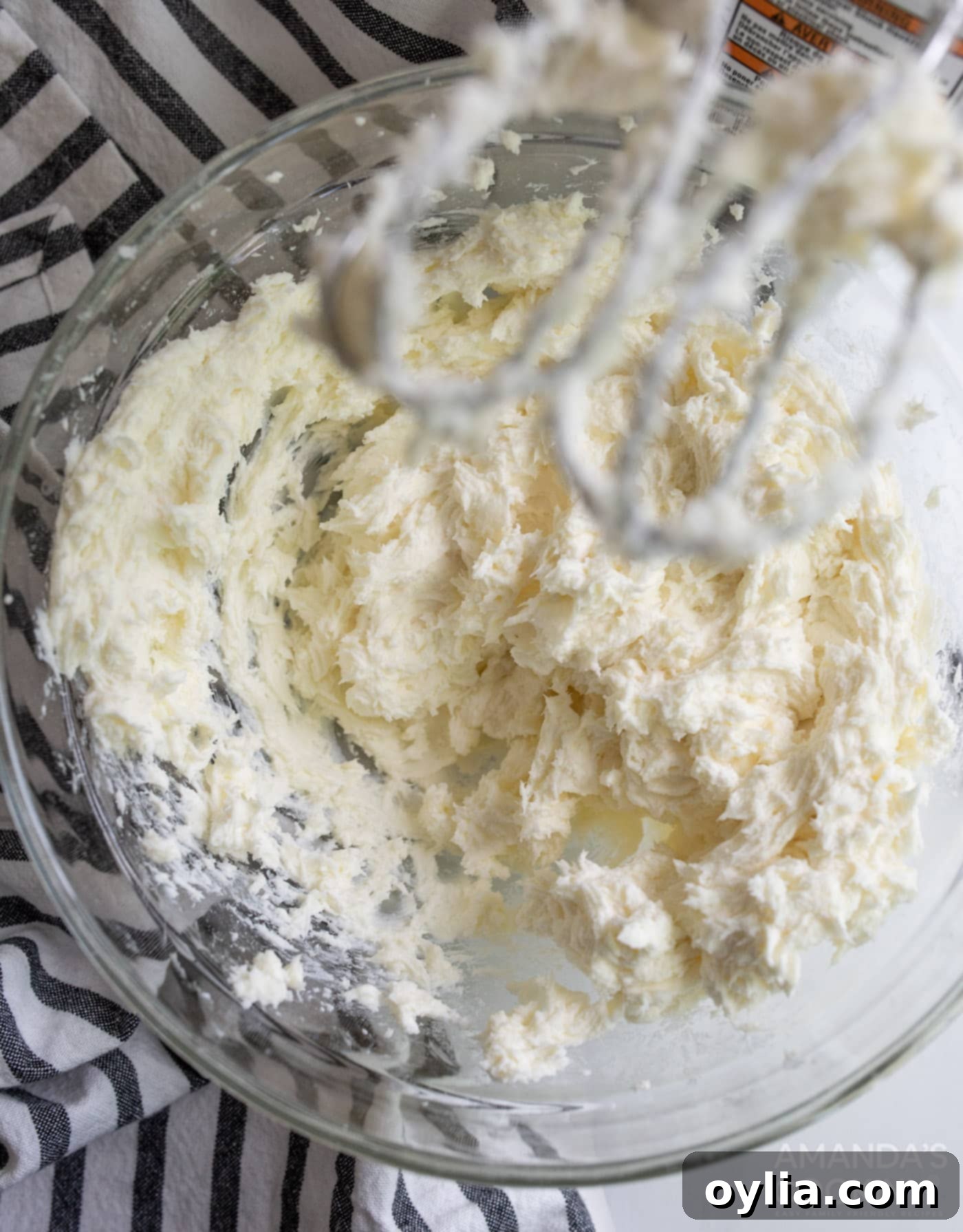 cream cheese, sugar, and flour mixed in bowl