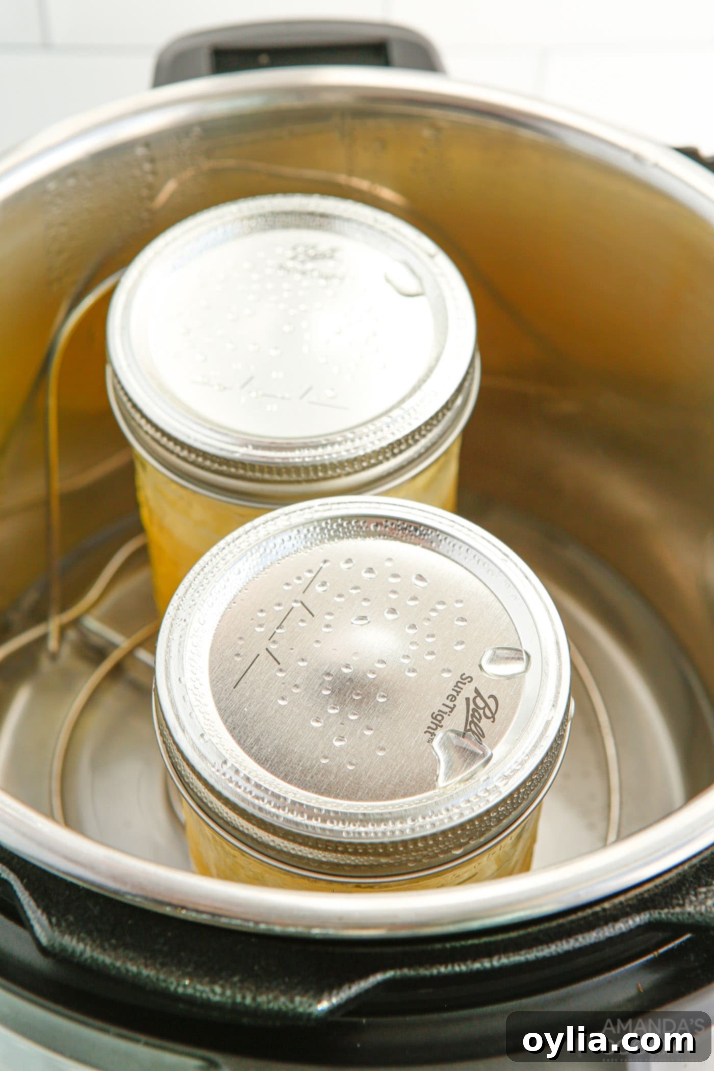 mason jars with lemon curd in an instant pot trivet