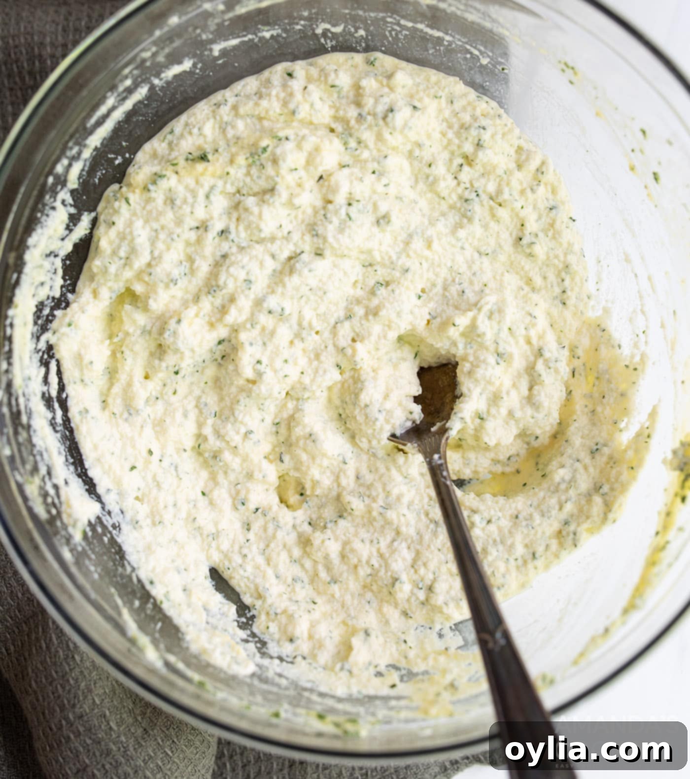 ricotta, egg, and parsley mixed in a bowl