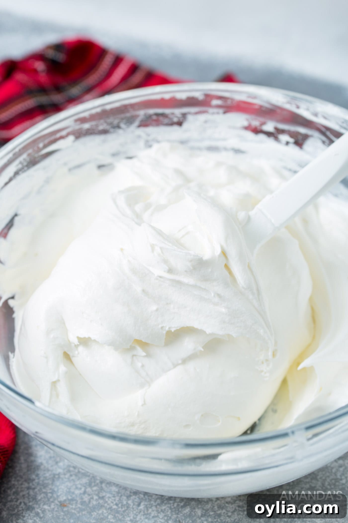 cream cheese, whipped topping and marshmallow fluff in a bowl