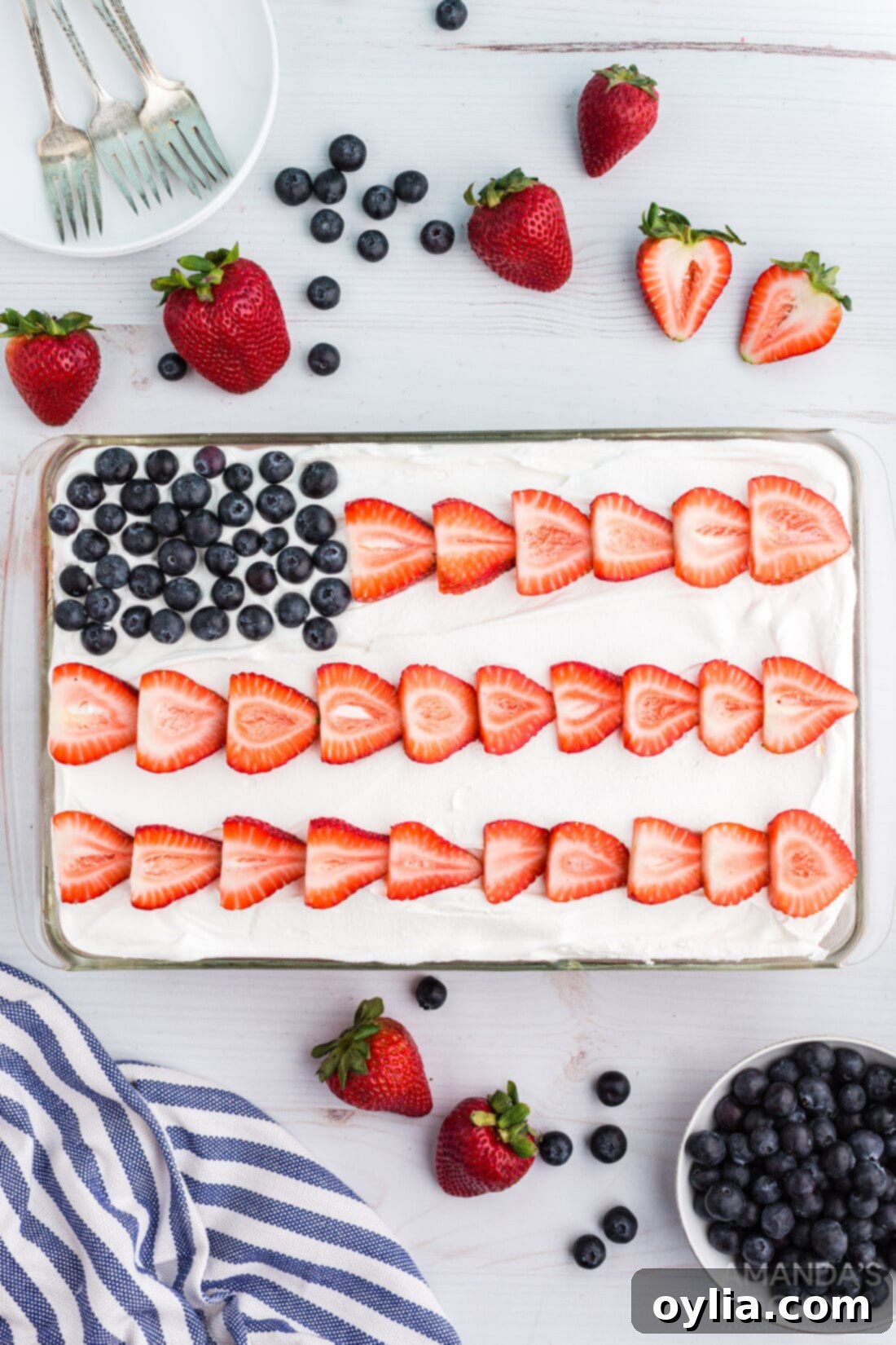 Patriotic American flag decorated poke cake with red, white, and blue colors