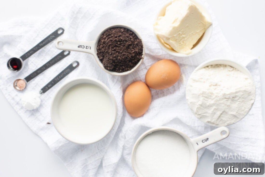 A clear glass bowl filled with crushed Oreo cookies, a key ingredient for the cheesecake bars.