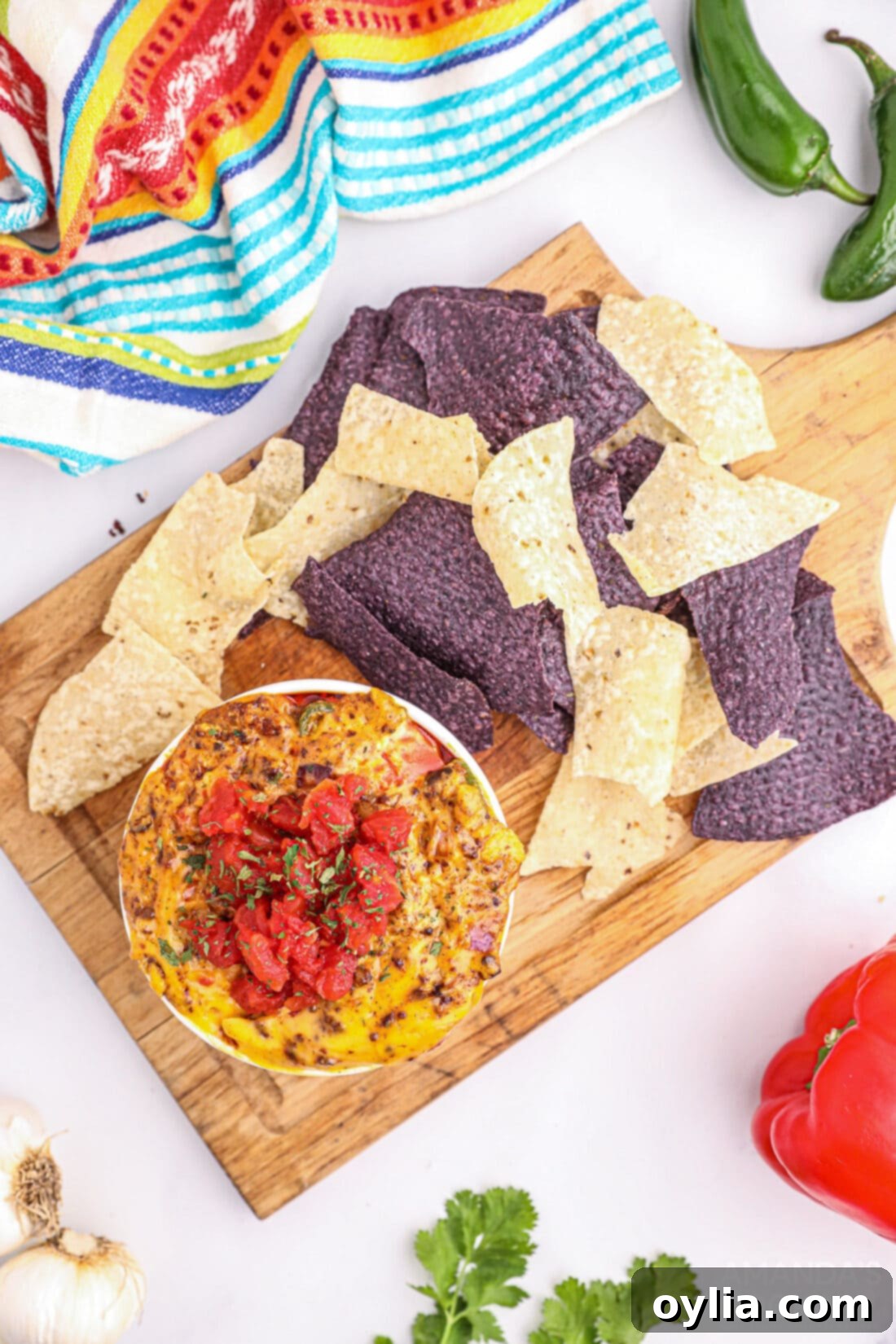 Smoked Queso Dip served in a rustic bowl with tortilla chips for dipping