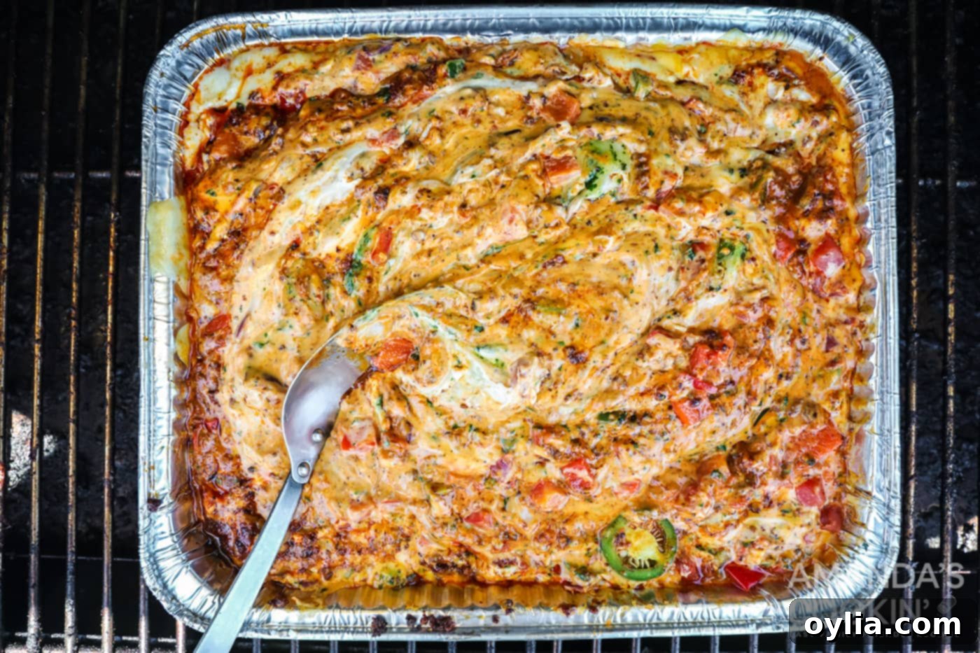 Finished Smoked Queso Dip in a pan, inspired by TikTok, ready to serve