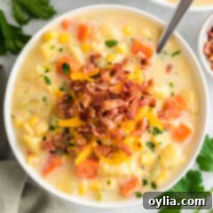 Sunshine Corn Chowder 11 A beautiful bowl of creamy Corn Chowder, topped with crispy bacon bits.