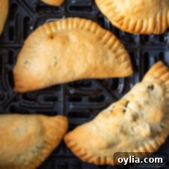 Crispy Air Fryer Empanadas 11 empanadas in an air fryer basket