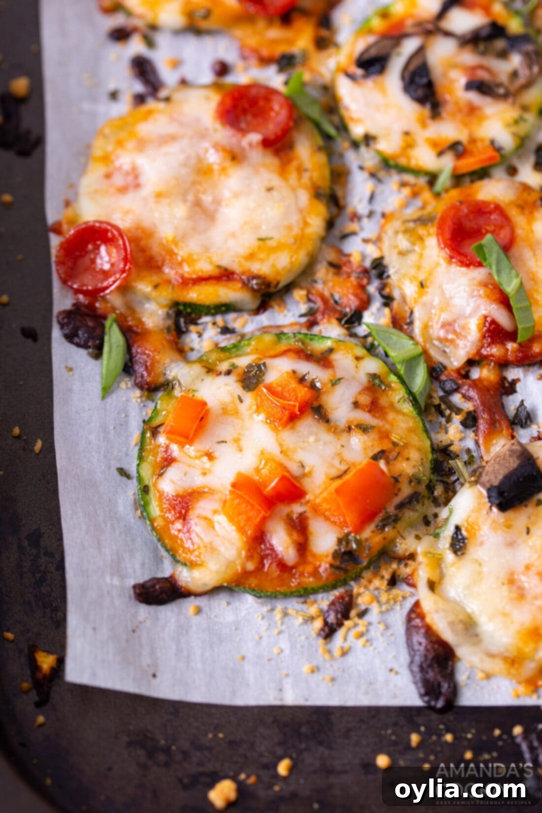 Zucchini Pizza Bites on parchment