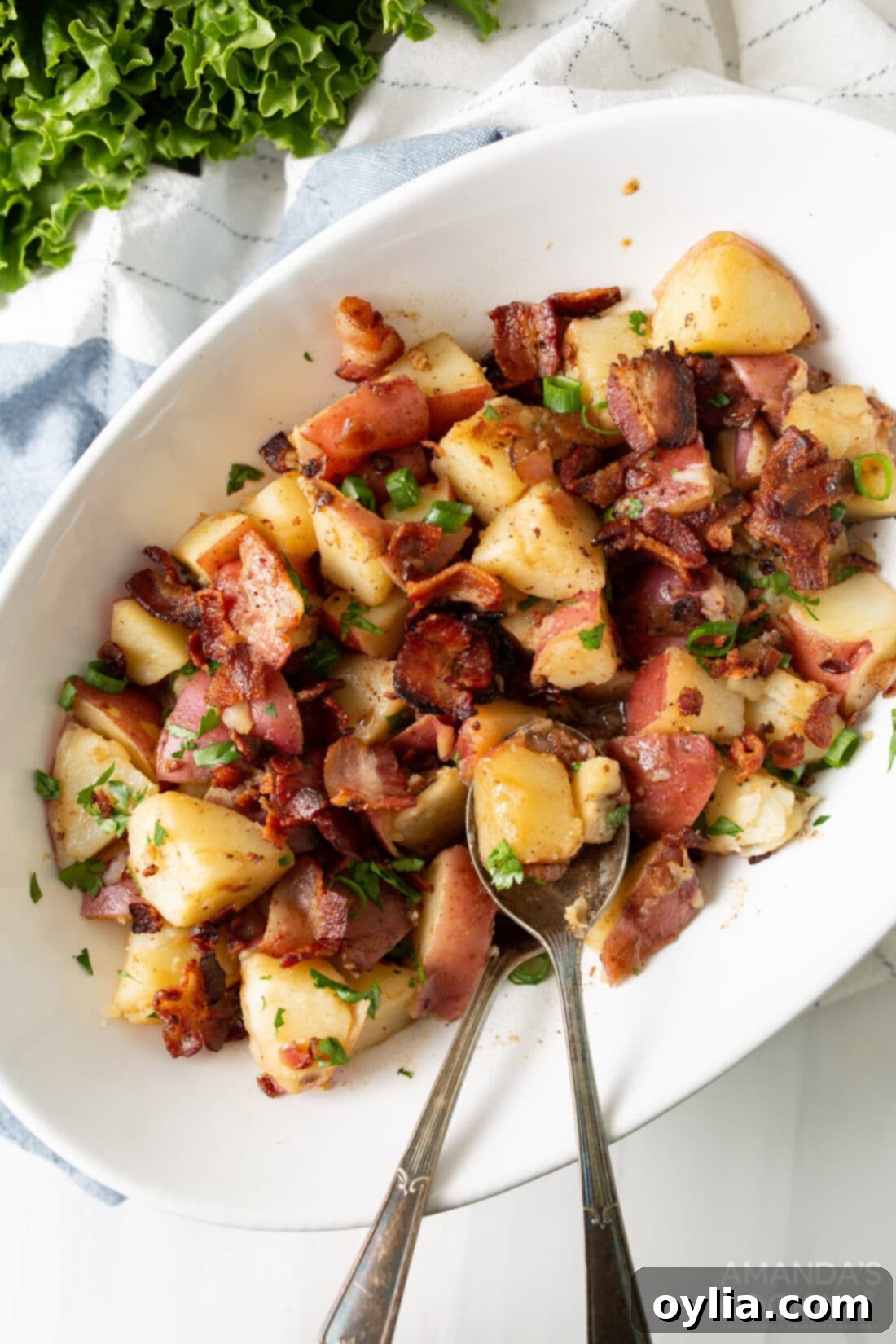 platter of warm German Potato Salad with bacon and herbs