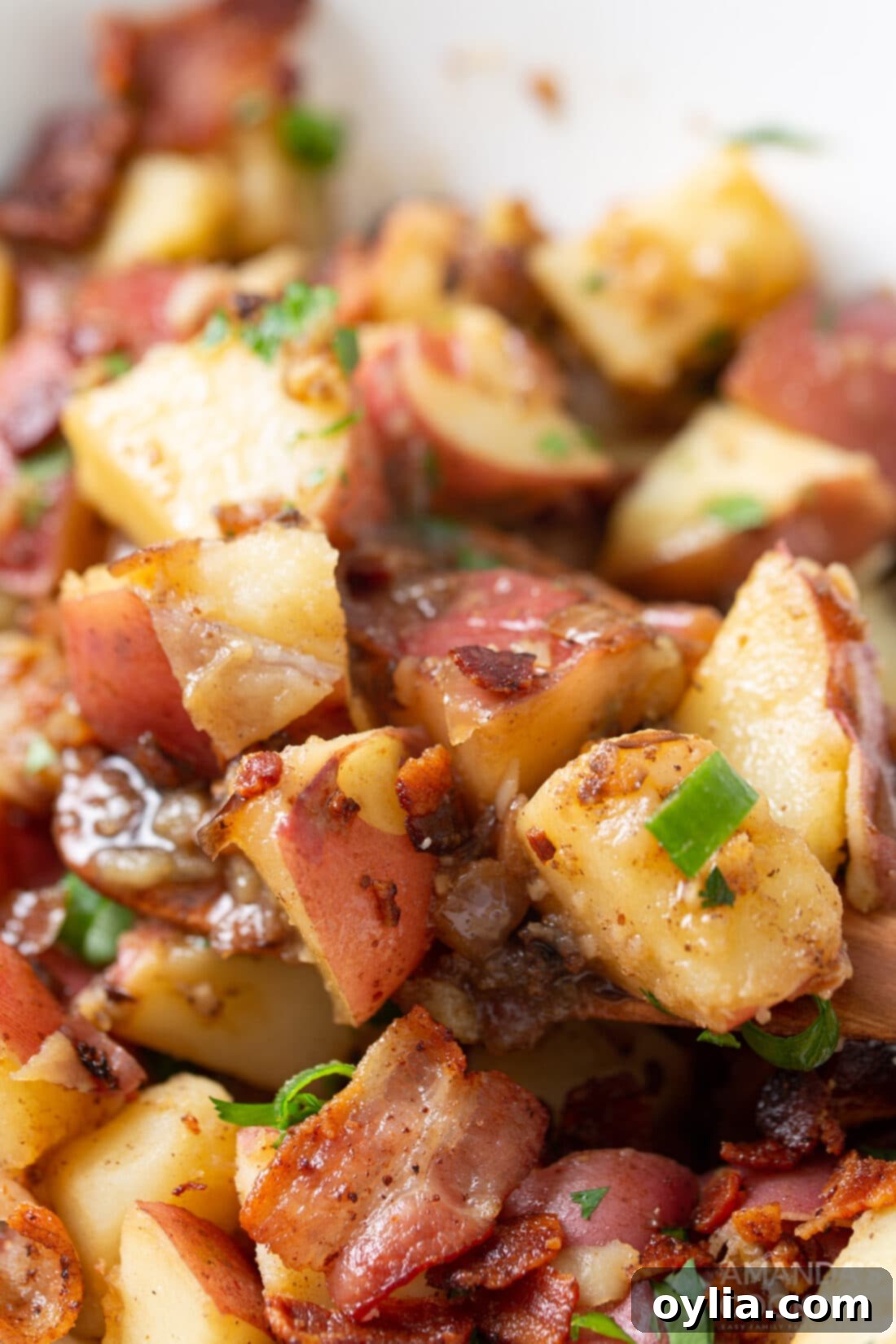 close up of warm German Potato Salad with bacon bits