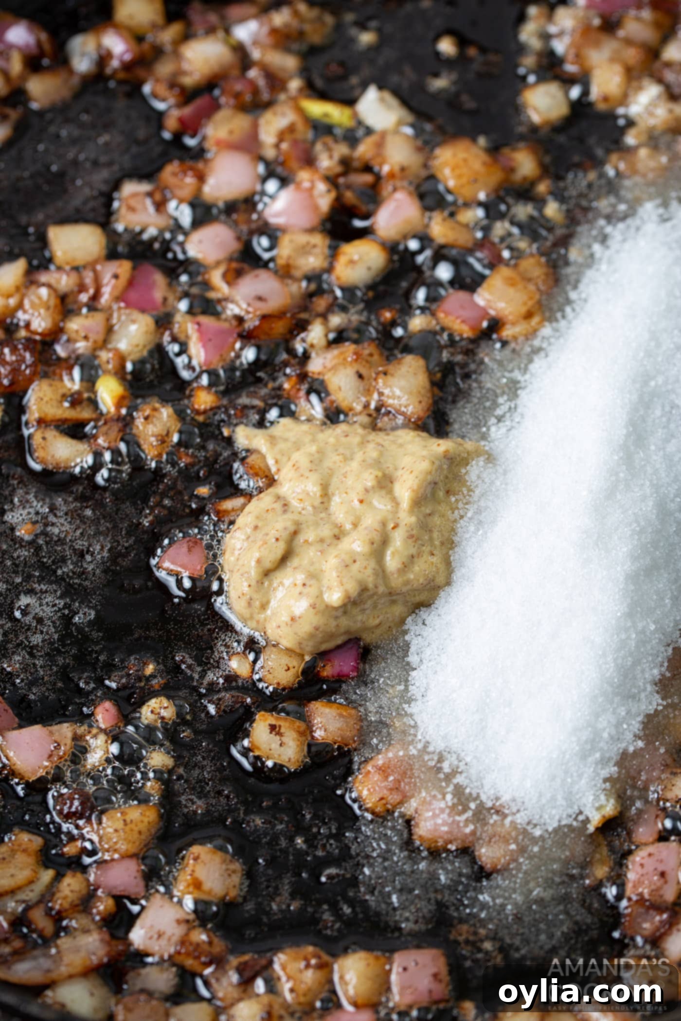 purple onion, garlic, dijon, and sugar in a skillet for German Potato Salad dressing