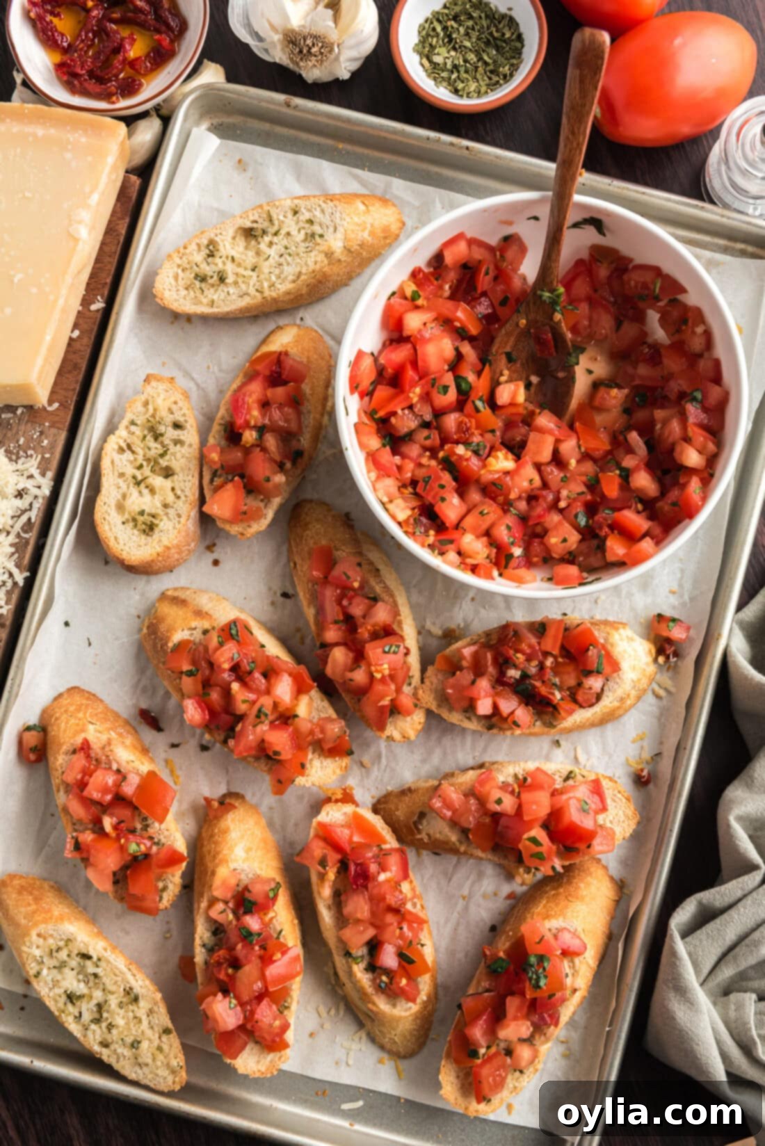 Pan of Bruschetta with a bowl of Bruschetta to the side
