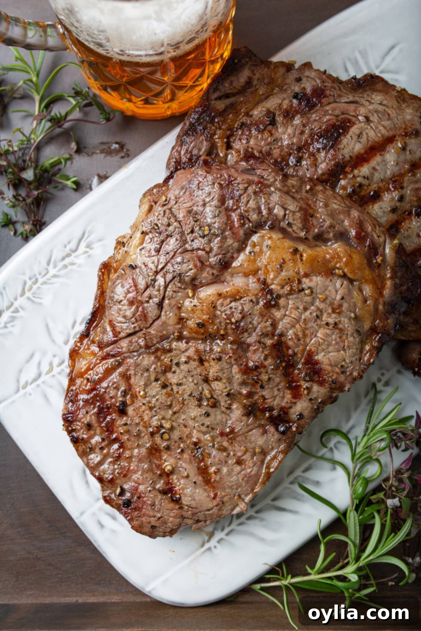 A perfectly grilled steak resting on a plate.