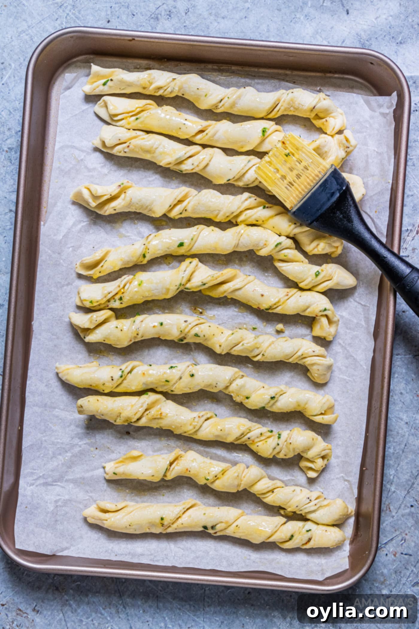 brushing parmesan twists with butter before air frying