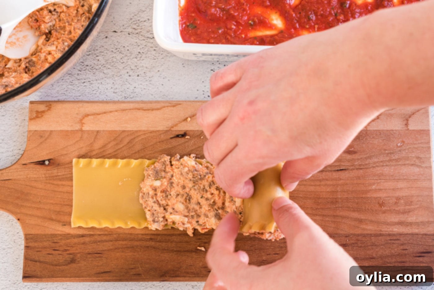 rolling lasagna noodle with filling