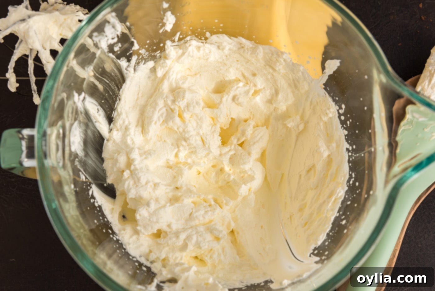 heavy whipping cream beaten in a bowl