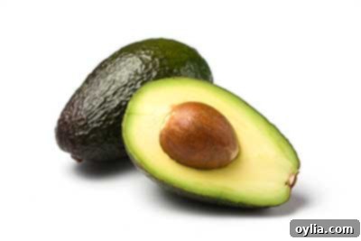Fresh, ripe avocado halves, rich in healthy fats