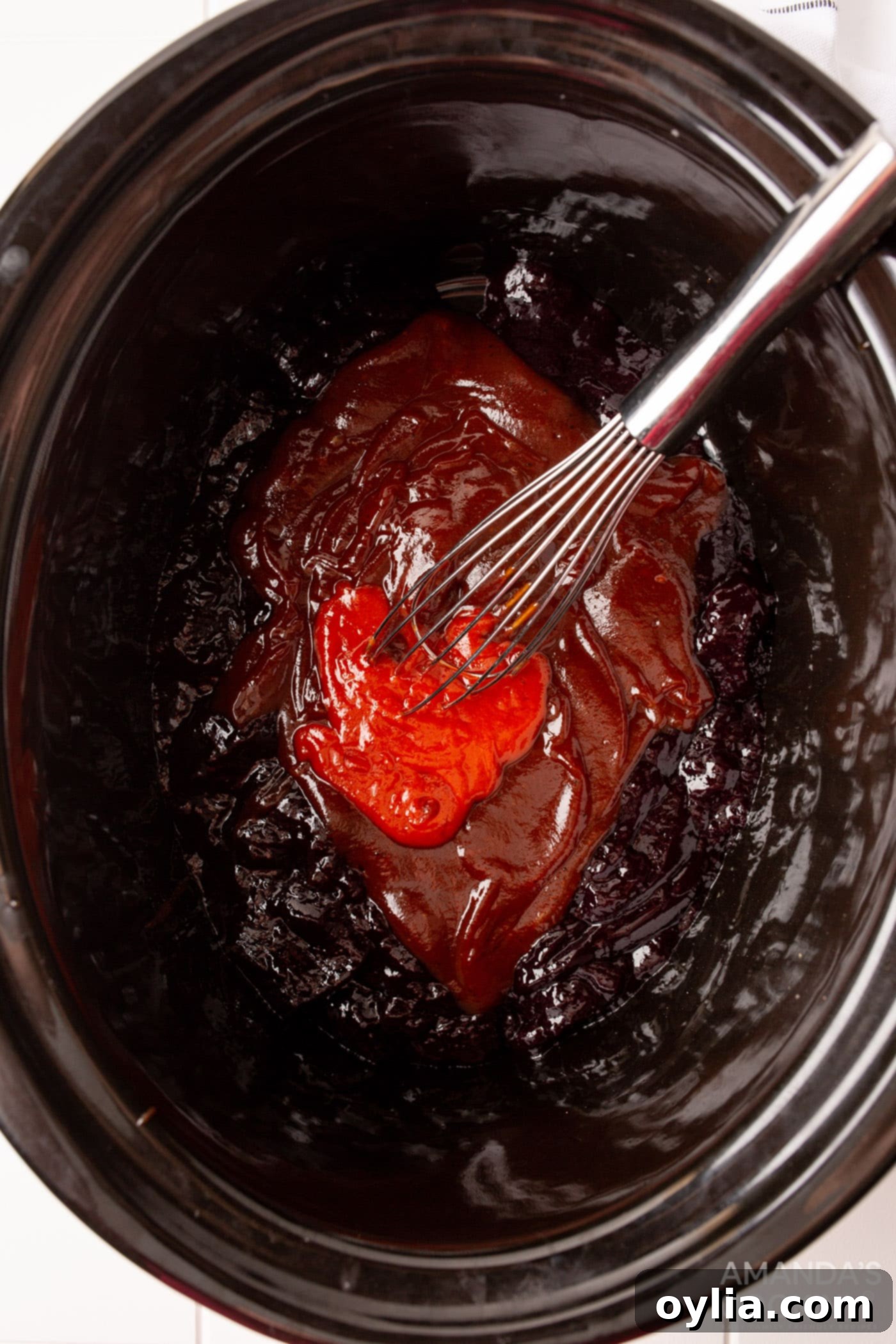 sweet and spicy meatball sauce in crockot