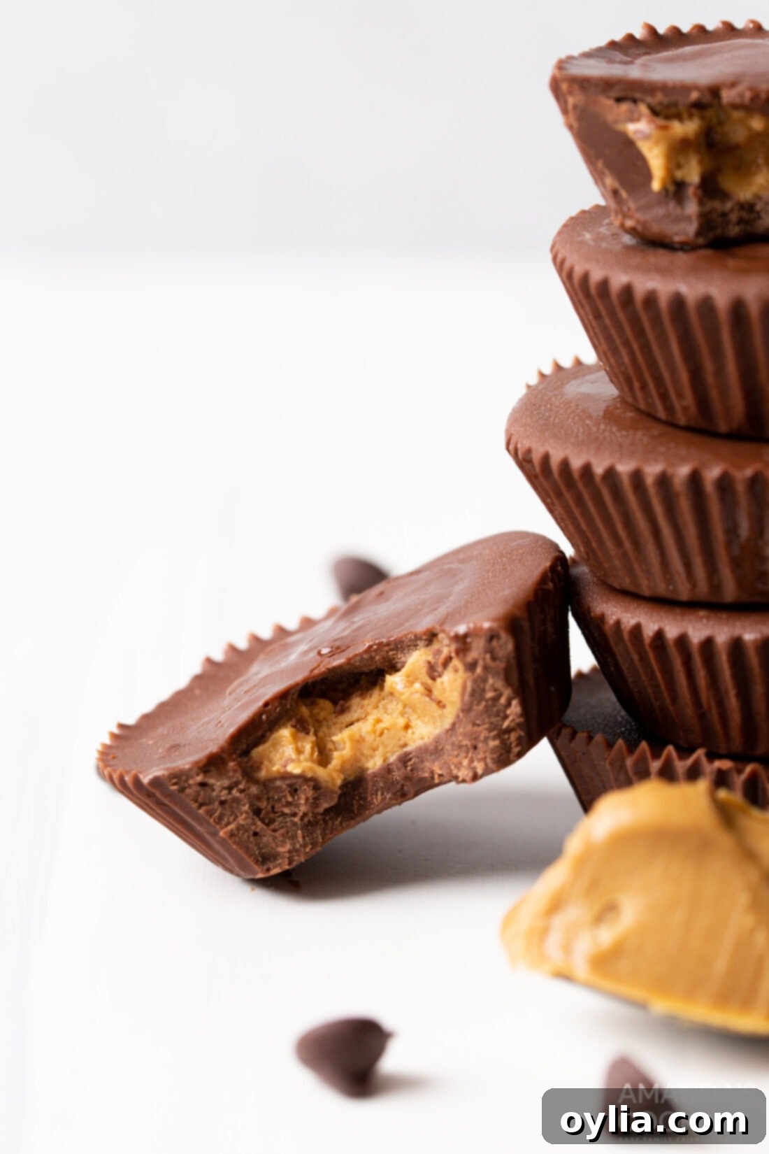 A homemade peanut butter cup with a bite taken out, revealing the smooth peanut butter filling.