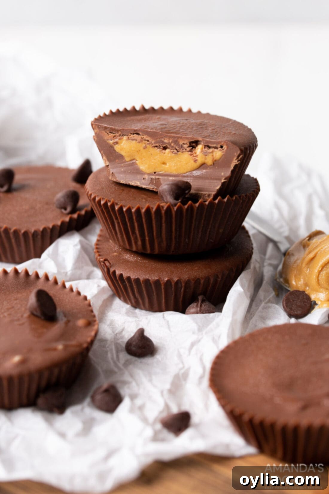 A perfectly stacked arrangement of homemade peanut butter cups, showcasing their uniform shape and tempting appearance.