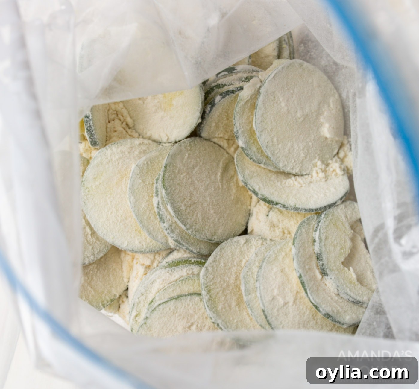 zucchini slices in a bag with flour