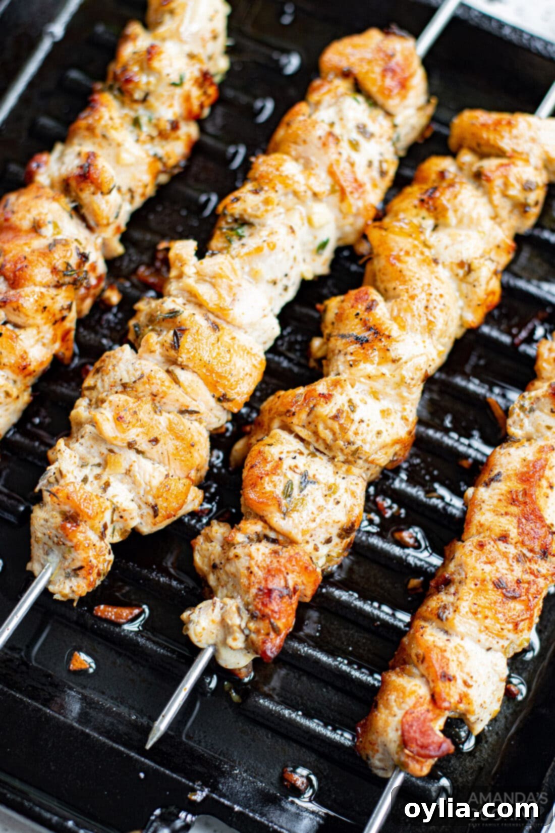 Greek Chicken Kabobs sizzling on the grill
