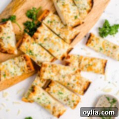 sliced garlic bread on a cutting board