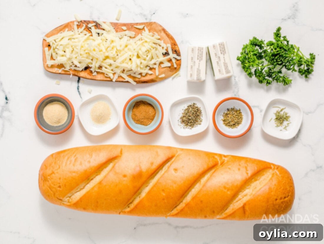 A spread of fresh ingredients for making Cheesy Garlic Bread, including a loaf of bread, butter, cheese, and various spices
