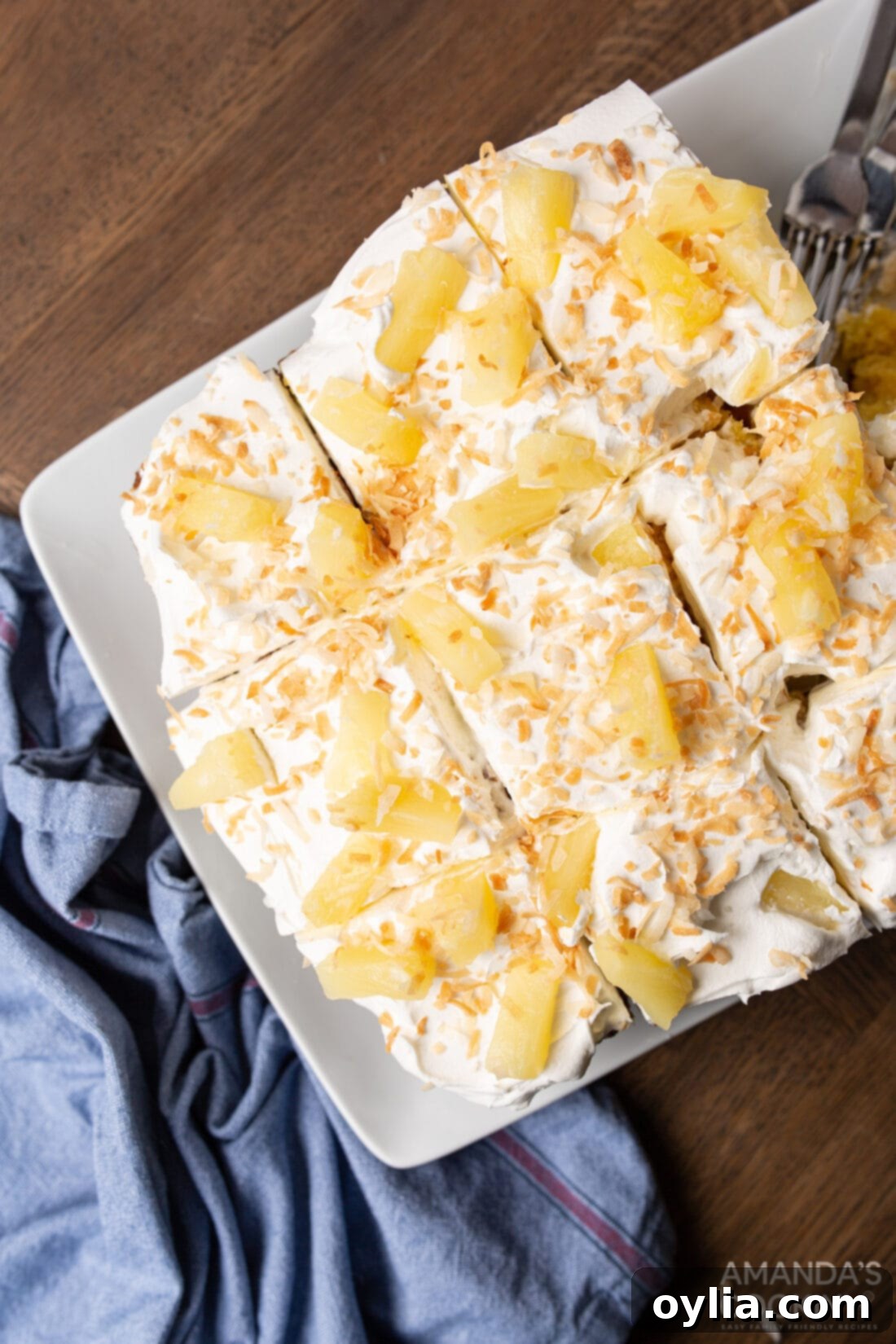 Golden Pineapple Poke Bliss 2 pineapple cake with pineapple garnish cut into slices