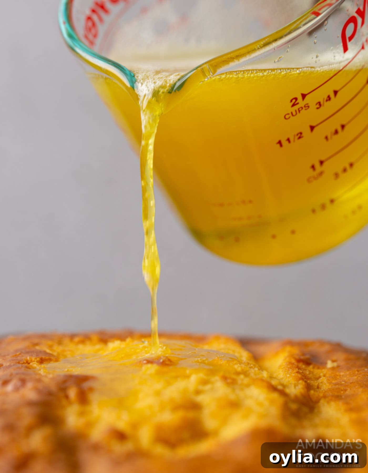 pouring jello over cake