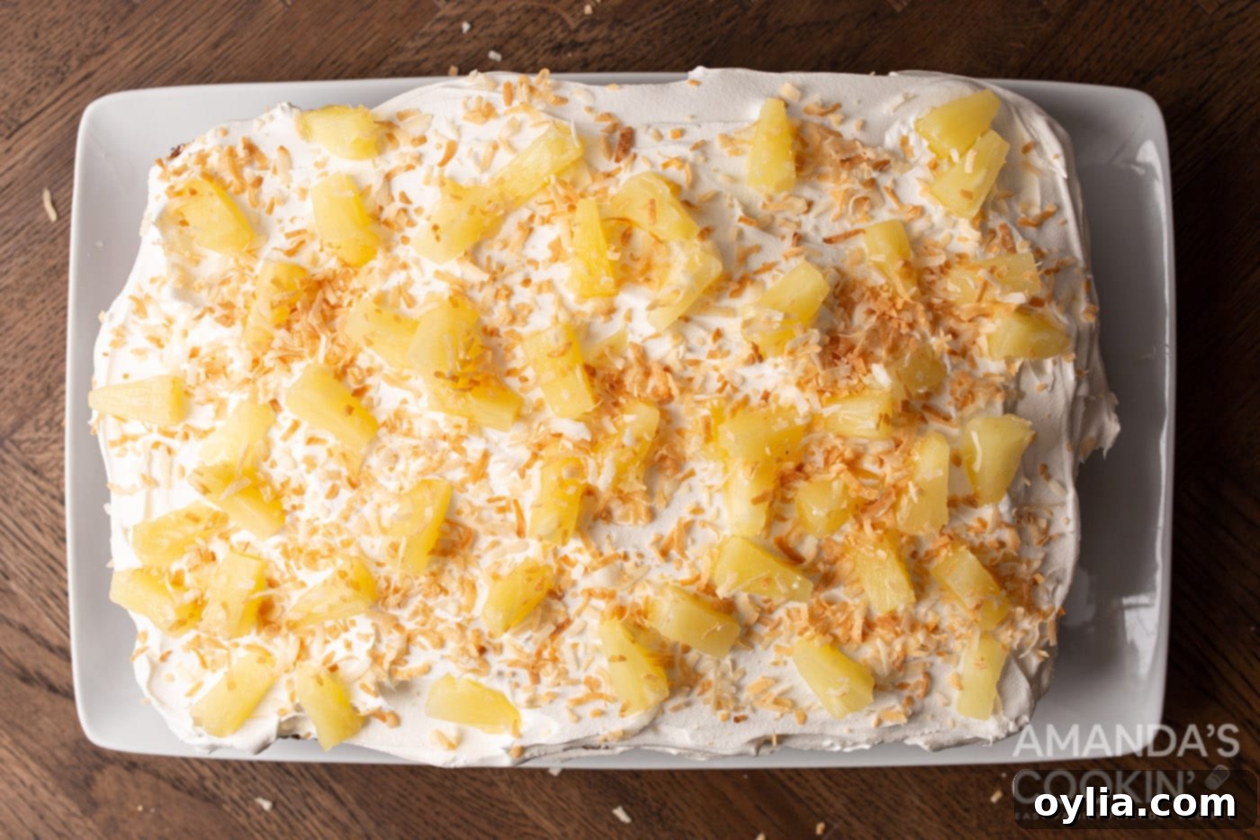 pineapple cake overhead with pineapple chunks and toasted coconut