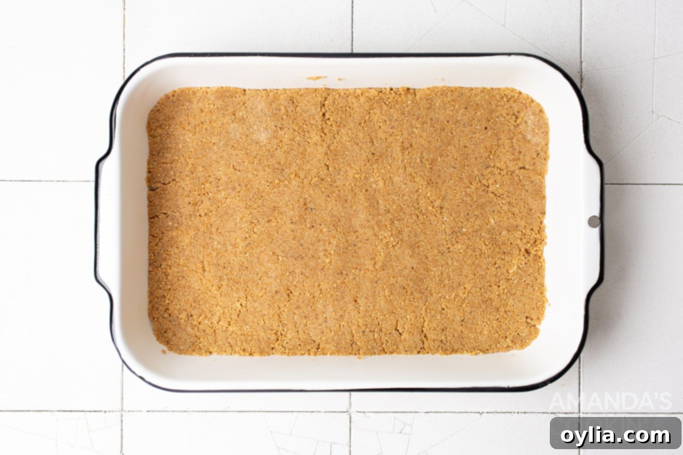 graham cracker crust in a baking pan