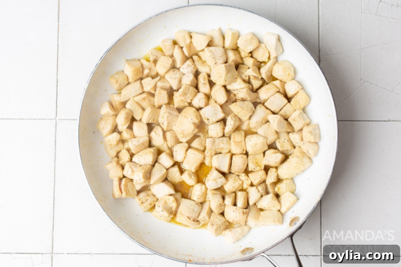 cubed chicken in a skillet