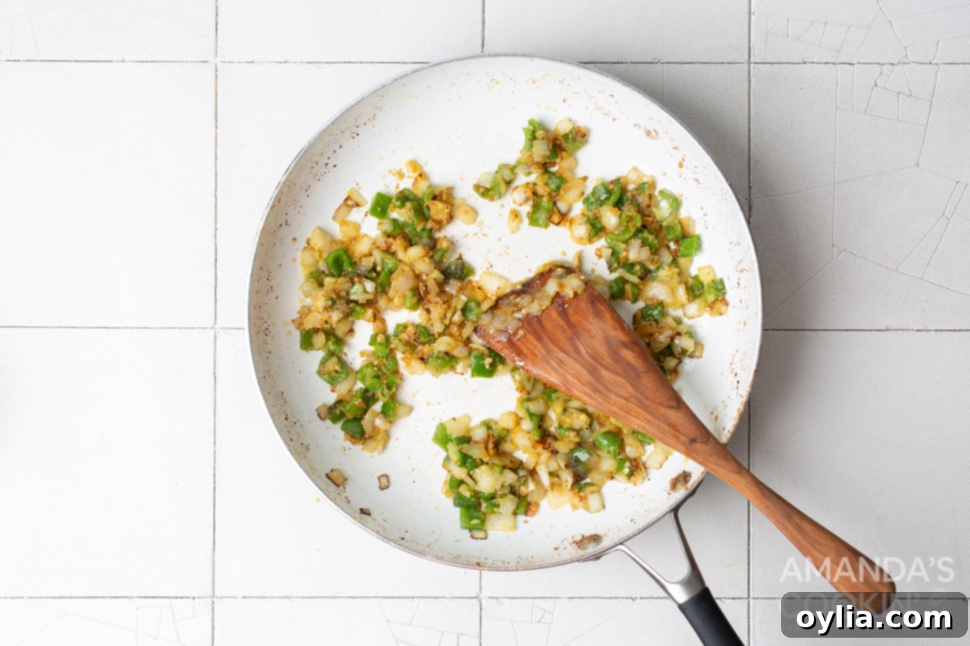 garlic onion and pepper sauteeing in a skillet