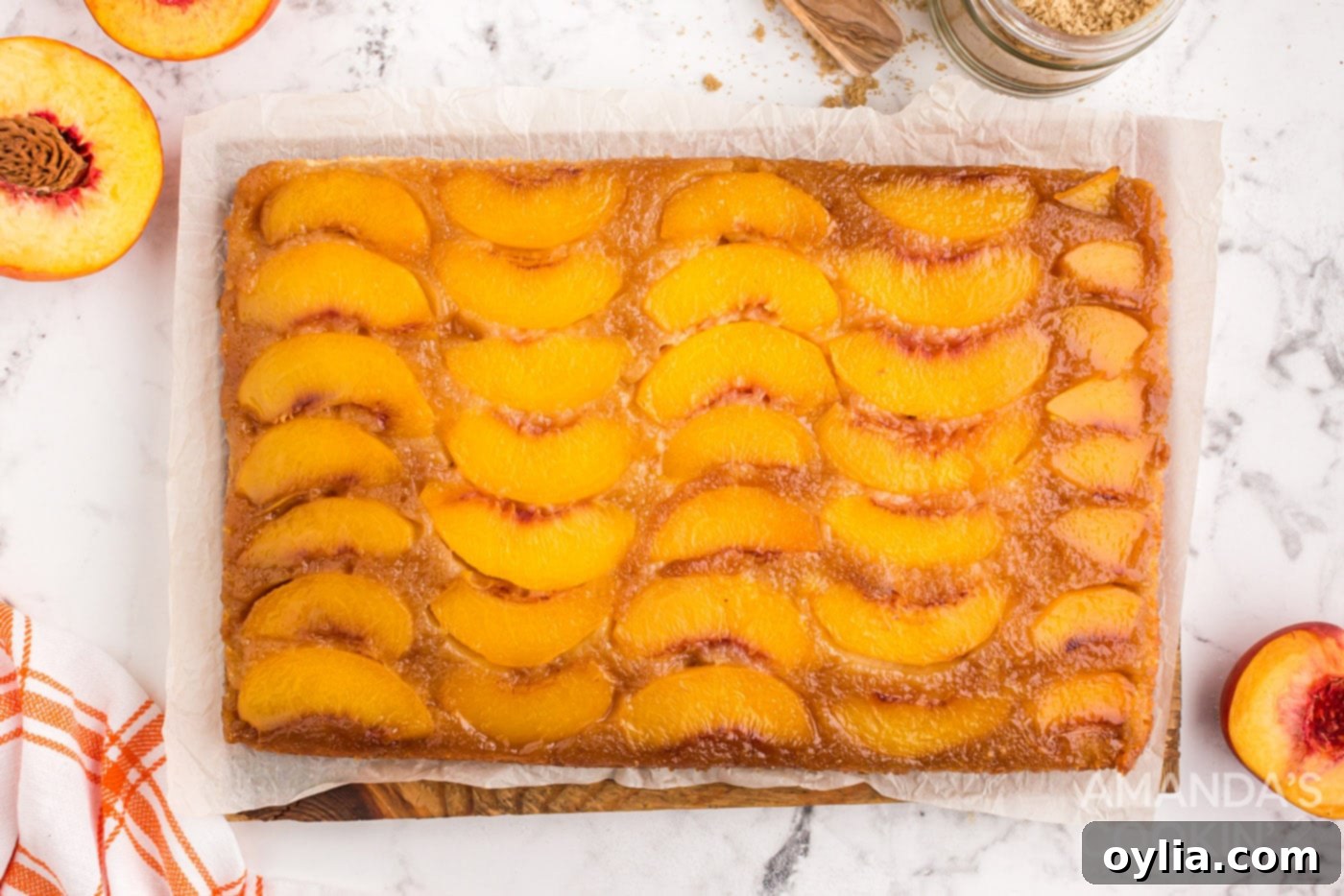 Golden Peach Upside Down Cake 12 baked peach upside down cake in a glass dish