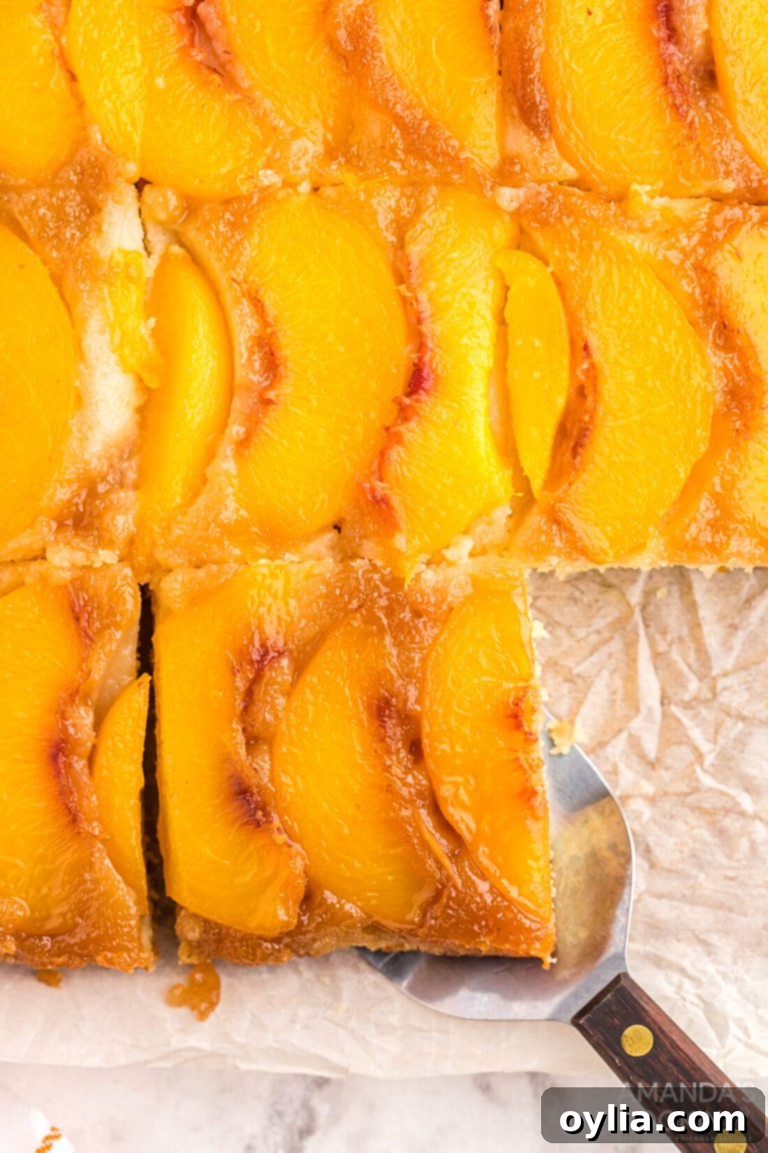 Golden Peach Upside Down Cake 13 overhead shot of sliced Peach Upside Down Cake