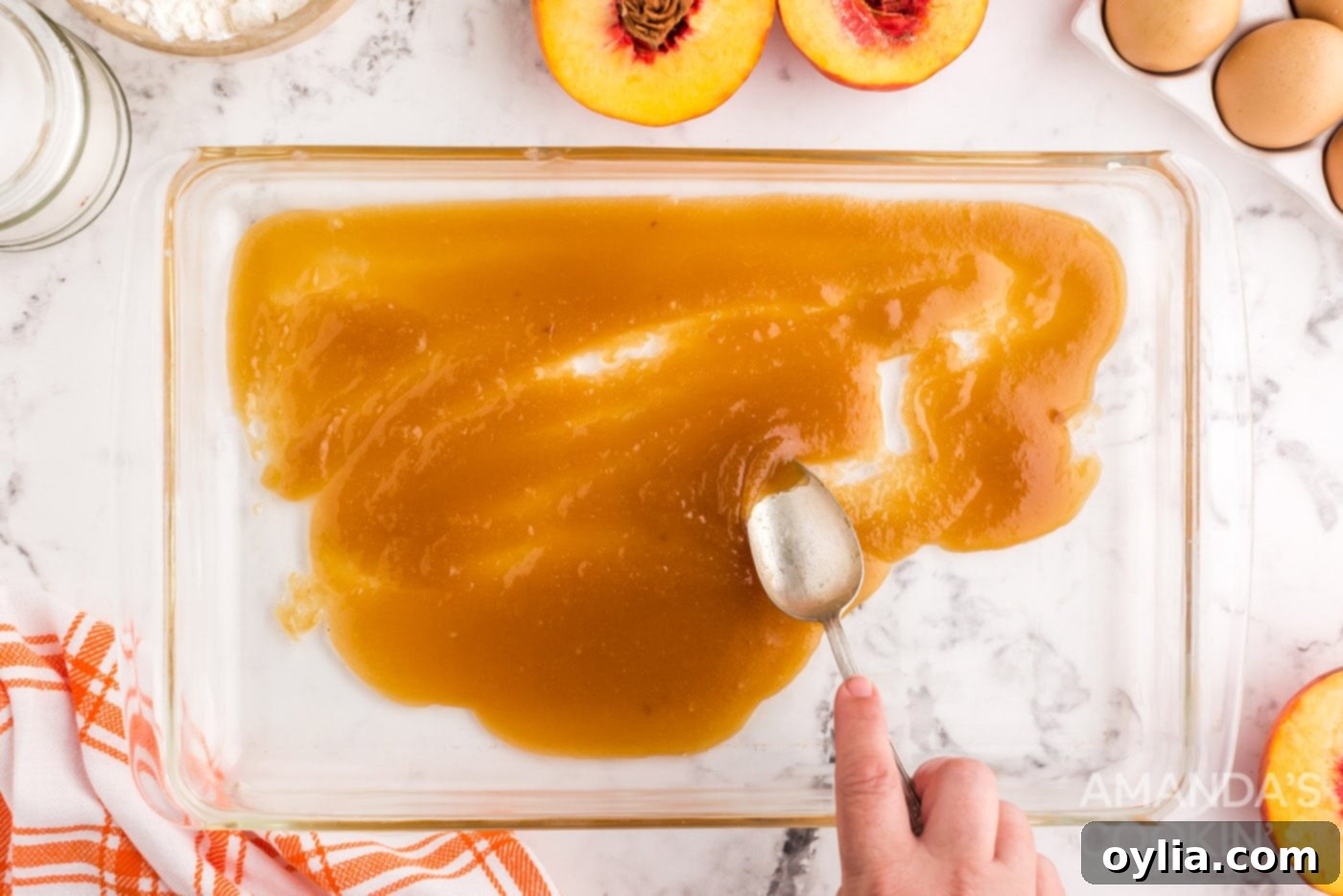 Golden Peach Upside Down Cake 5 melted butter and brown sugar spread onto glass baking dish