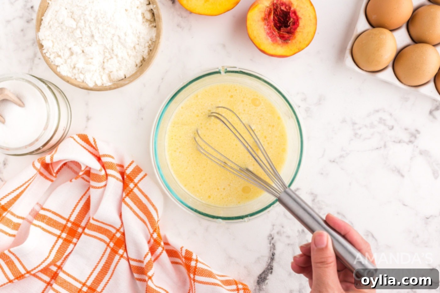 Golden Peach Upside Down Cake 8 whisking milk, eggs, oil, vanilla, and almond extracts