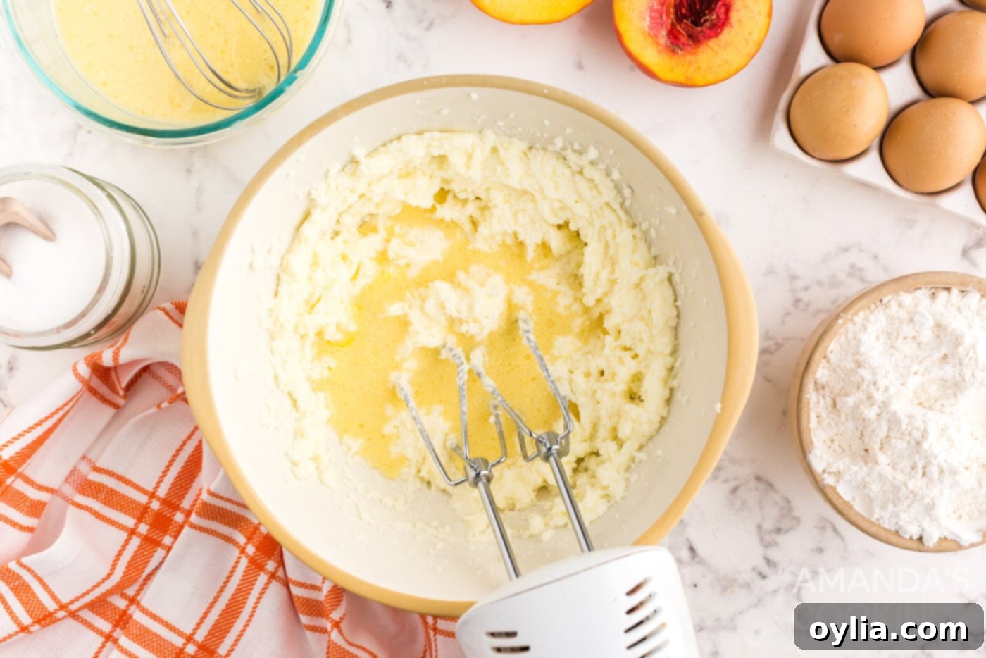 Golden Peach Upside Down Cake 9 beating cake batter with a mixer
