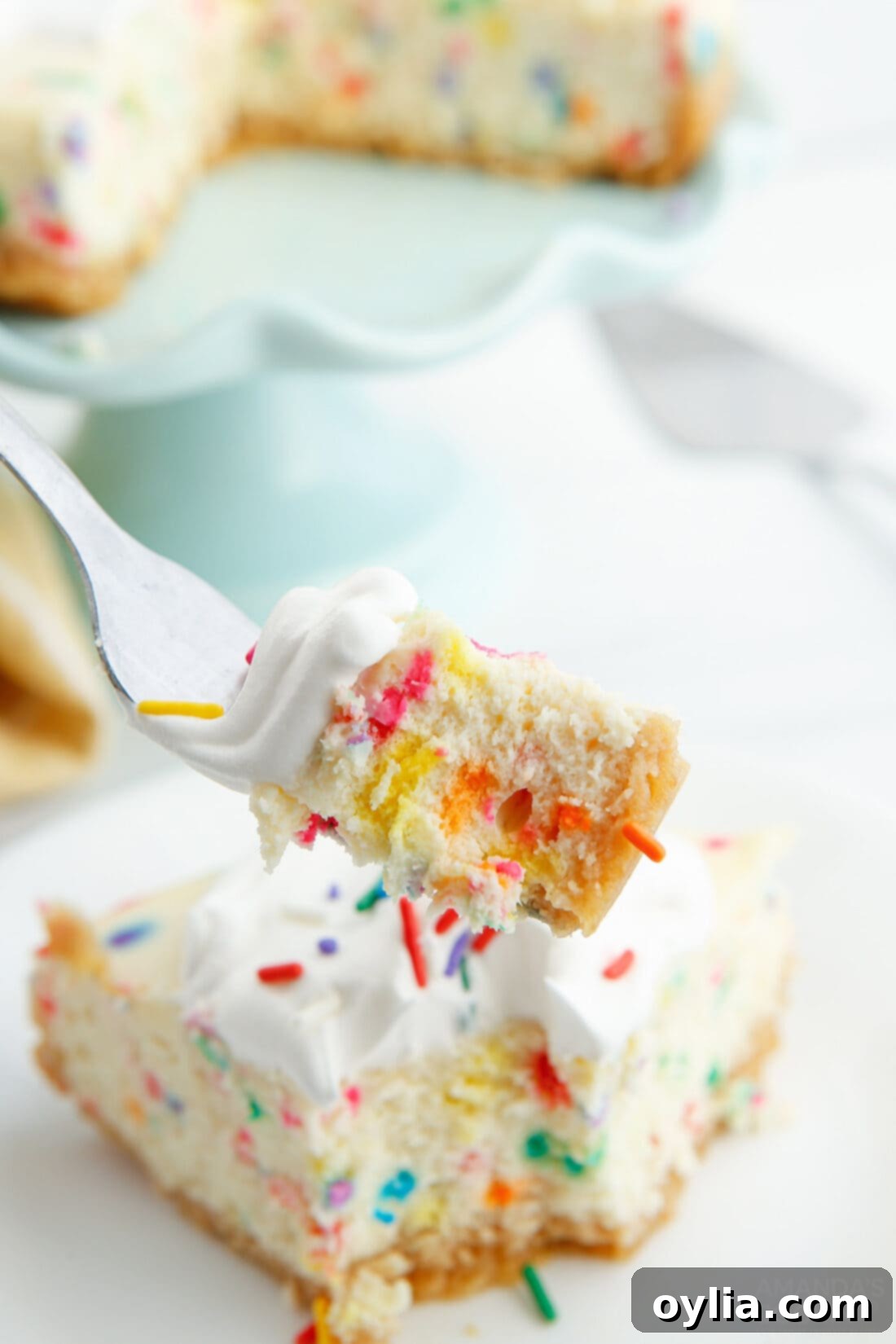 fork full of Instant Pot Funfetti Cheesecake