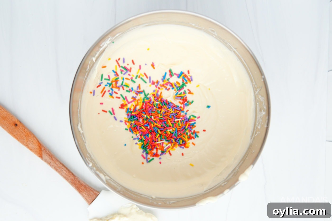 cream cheese mixture with funfetti sprinkles in a bowl
